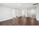Upstairs bonus room with hardwood flooring and neutral paint at 4416 Water Mill Dr, Buford, GA 30519