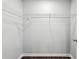 Empty walk-in closet with wire shelving and dark wood floors at 4416 Water Mill Dr, Buford, GA 30519