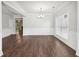 Open concept dining area filled with natural light and wood-look floors, perfect for entertaining at 4416 Water Mill Dr, Buford, GA 30519