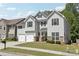 Attractive two-story home with a double garage, stone accents, and a well-kept lawn at 4416 Water Mill Dr, Buford, GA 30519