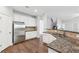 Bright kitchen features white cabinetry, stainless steel appliances, and granite countertops at 4416 Water Mill Dr, Buford, GA 30519