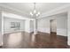 Spacious living room features an open floor plan with abundant natural light and wood-look flooring at 4416 Water Mill Dr, Buford, GA 30519
