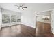 Bright sunroom with hardwood floors, natural light, and kitchen access at 4416 Water Mill Dr, Buford, GA 30519