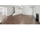 Expansive living room with a staircase, fireplace, and hardwood floors at 4416 Water Mill Dr, Buford, GA 30519
