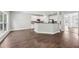 Open-concept living room and kitchen with hardwood floors and natural light at 4416 Water Mill Dr, Buford, GA 30519