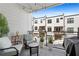 Relaxing balcony with patio seating, overhead string lights, and views of the modern community at 511 Burton Dr # 805, Alpharetta, GA 30009