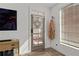 Inviting entryway with a glass-paneled door, wood-look flooring, and a convenient coat rack and window at 511 Burton Dr # 805, Alpharetta, GA 30009