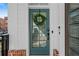 Stylish front door with a decorative wreath and modern hardware at 511 Burton Dr # 805, Alpharetta, GA 30009