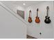 Stylish hallway features wall-mounted guitars and a modern design with a grey door and fresh white walls at 511 Burton Dr # 805, Alpharetta, GA 30009