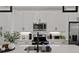 Bright kitchen featuring white cabinets, stainless steel appliances, and a stylish black faucet at 511 Burton Dr # 805, Alpharetta, GA 30009