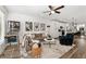Spacious living room featuring an open floor plan, modern decor, and beautiful hardwood floors at 511 Burton Dr # 805, Alpharetta, GA 30009