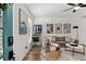 Inviting living room featuring a comfortable sofa, modern art, and plenty of natural light at 511 Burton Dr # 805, Alpharetta, GA 30009