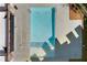 Aerial view of a clean, rectangular pool surrounded by a concrete deck and well-maintained landscaping at 511 Burton Dr # 805, Alpharetta, GA 30009