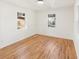 Bright bedroom with hardwood floors, white walls and two large windows that let in natural light at 578 Center Hill Nw Ave, Atlanta, GA 30318