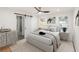 Stylized bedroom with ceiling fan, barn door, plush carpet, and neutral tones at 578 Center Hill Nw Ave, Atlanta, GA 30318