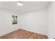 Bedroom featuring hardwood flooring, a window providing natural light, and freshly painted walls at 578 Center Hill Nw Ave, Atlanta, GA 30318