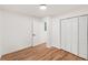 This bedroom features hardwood floors, a flush mount ceiling light, and a closet with paneled doors at 578 Center Hill Nw Ave, Atlanta, GA 30318