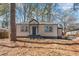 Charming home featuring updated siding, a welcoming front porch, and well-maintained landscaping at 578 Center Hill Nw Ave, Atlanta, GA 30318