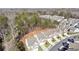 An aerial view of a suburban neighborhood showcasing well-maintained homes and lush green trees at 103 Bryon Ln, Acworth, GA 30102