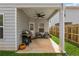 Relaxing covered patio with ceiling fan, outdoor furniture and a barbecue grill at 103 Bryon Ln, Acworth, GA 30102