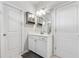 Bathroom featuring vanity with cabinets and drawers, a mirror, and modern lighting at 103 Bryon Ln, Acworth, GA 30102