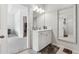 Bathroom featuring a vanity, mirror, tile flooring, and view to the walk-in closet at 103 Bryon Ln, Acworth, GA 30102