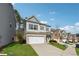View of home with lawn and driveway with gray siding and brick two car garage at 103 Bryon Ln, Acworth, GA 30102