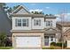 Charming two-story home with a brick and siding exterior and a two-car garage at 103 Bryon Ln, Acworth, GA 30102