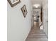 Hallway features wood-look floors, light gray walls, and modern decorations at 103 Bryon Ln, Acworth, GA 30102