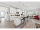 Kitchen boasts granite countertops, stainless appliances, and breakfast bar seating at 103 Bryon Ln, Acworth, GA 30102