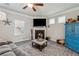 Comfortable living room with a fireplace, a ceiling fan, and large windows at 103 Bryon Ln, Acworth, GA 30102