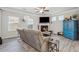 Inviting living room boasts a fireplace, ceiling fan, and multiple windows for natural light at 103 Bryon Ln, Acworth, GA 30102