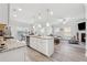Open-concept living space with modern kitchen, island, and a cozy seating area at 103 Bryon Ln, Acworth, GA 30102