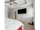 Large primary bedroom has a ceiling fan, tv and natural light at 103 Bryon Ln, Acworth, GA 30102