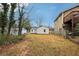 Large backyard with a view of the house and neighboring property at 1906 Turpin Se Rd, Smyrna, GA 30080