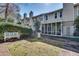 Backyard area with a screened-in porch and established landscaping at 2000 Variations Dr, Atlanta, GA 30329
