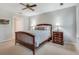 Bedroom featuring a wood bed frame, neutral walls, and ample natural light at 2000 Variations Dr, Atlanta, GA 30329