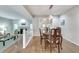 Open-concept dining room featuring hardwood floors and access to the living room at 2000 Variations Dr, Atlanta, GA 30329