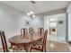 Open-concept dining room featuring hardwood floors and access to the living room at 2000 Variations Dr, Atlanta, GA 30329
