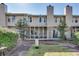 Exterior of the house with a screened-in porch and a well-maintained yard at 2000 Variations Dr, Atlanta, GA 30329