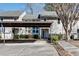 Well-maintained townhouse with a convenient carport, manicured landscaping, and a welcoming front entrance at 2000 Variations Dr, Atlanta, GA 30329