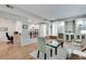 Open living area with built-in shelving, hardwood floors, and seamless flow to dining and office spaces at 2000 Variations Dr, Atlanta, GA 30329