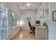 Bright office space with hardwood floors, built-in cabinets, and a modern desk setup at 2000 Variations Dr, Atlanta, GA 30329