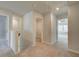 Upstairs hallway boasts carpet and access to multiple rooms at 224 Sanctuary Dr, Mcdonough, GA 30253