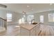 Bright, open-concept kitchen features a central island and stainless steel appliances at 224 Sanctuary Dr, Mcdonough, GA 30253