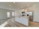 Bright, modern kitchen island featuring stainless steel appliances and open concept design at 224 Sanctuary Dr, Mcdonough, GA 30253