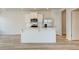 Modern kitchen island with stainless appliances and crisp white cabinets at 224 Sanctuary Dr, Mcdonough, GA 30253