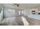 Open-concept living room featuring stainless steel appliances and bright, natural light at 224 Sanctuary Dr, Mcdonough, GA 30253