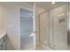 Bathroom with a walk in shower featuring tiled walls, shower head, and a seat at 117 Belvedere Rd, Mcdonough, GA 30253