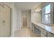Bathroom featuring double vanity, walk in shower, and ample storage space at 117 Belvedere Rd, Mcdonough, GA 30253